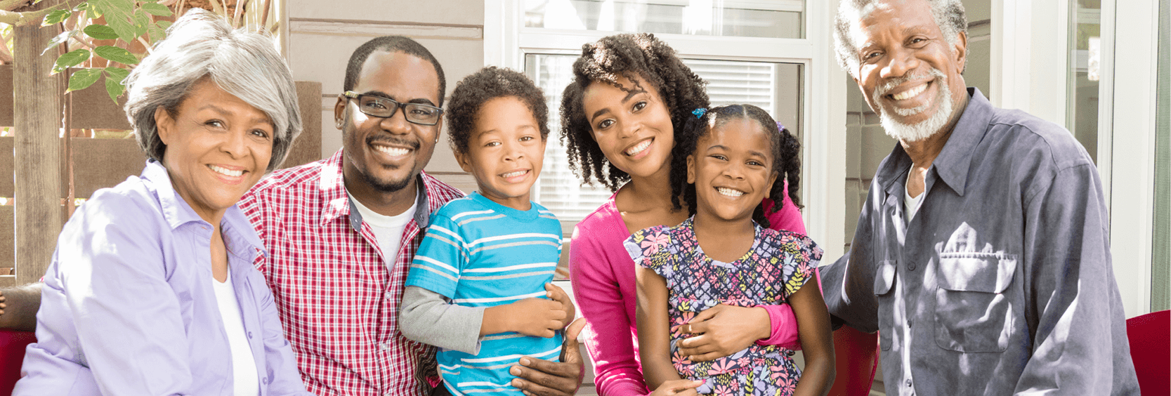 Multi-generational family smiling for a portrait